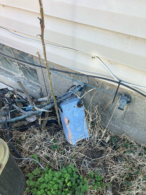 Conducted on-site evaluation and generated replacement estimate for non-operational central air conditioning unit and aging furnace system. Assessed exterior condenser unit showing significant weathering and potential mechanical failure, along with basement-located furnace equipment. Documented existing system conditions through photographic evidence, noting deteriorated outdoor unit placement, overgrown surrounding area, and accumulated debris near foundation. Provided comprehensive replacement recommendations for both heating and cooling equipment to restore full HVAC system functionality.