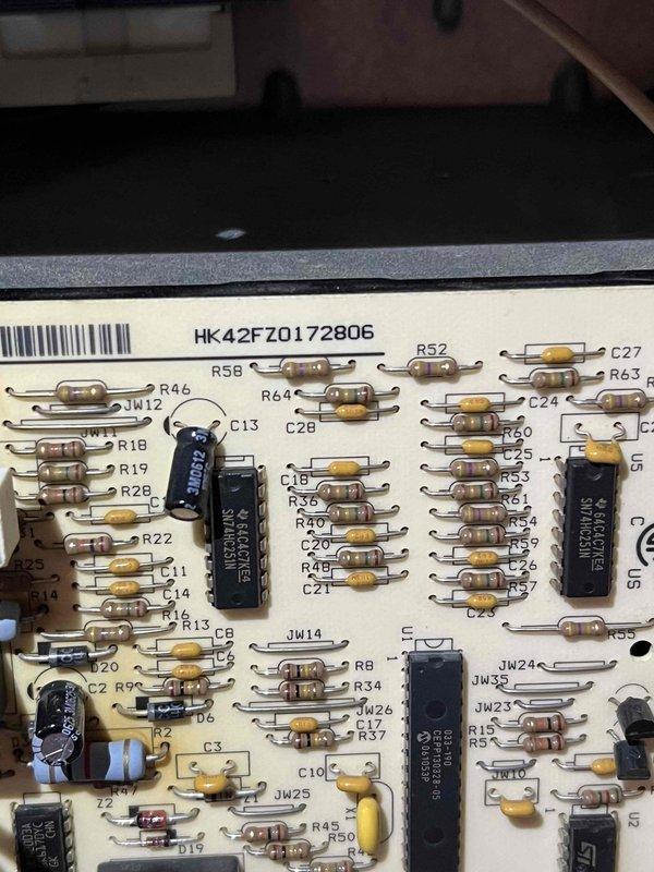 Responded to service call for 10+ year old furnace in basement experiencing unusual noises and inadequate heating. Performed diagnostic inspection revealing heavily contaminated return air grille with significant dust and debris accumulation restricting airflow. Examined control board (HK42FZ0172806) for potential electronic component failure or malfunction related to reported operational issues. Identified need for system cleaning and further evaluation of heating performance after airflow restoration.