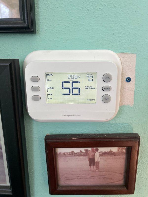 Successfully completed installation of 70,000 BTU furnace system with new programmable Honeywell thermostat and 40-gallon hot water heater. Installation included sump pump reconnection, gas line connections, and all necessary electrical work. Verified proper system operation with pressure readings at +1458 In-Wg, confirmed thermostat functionality displaying 56°F with heat cycle engaged, and submitted permit applications for mechanical and electrical work to ensure code compliance.