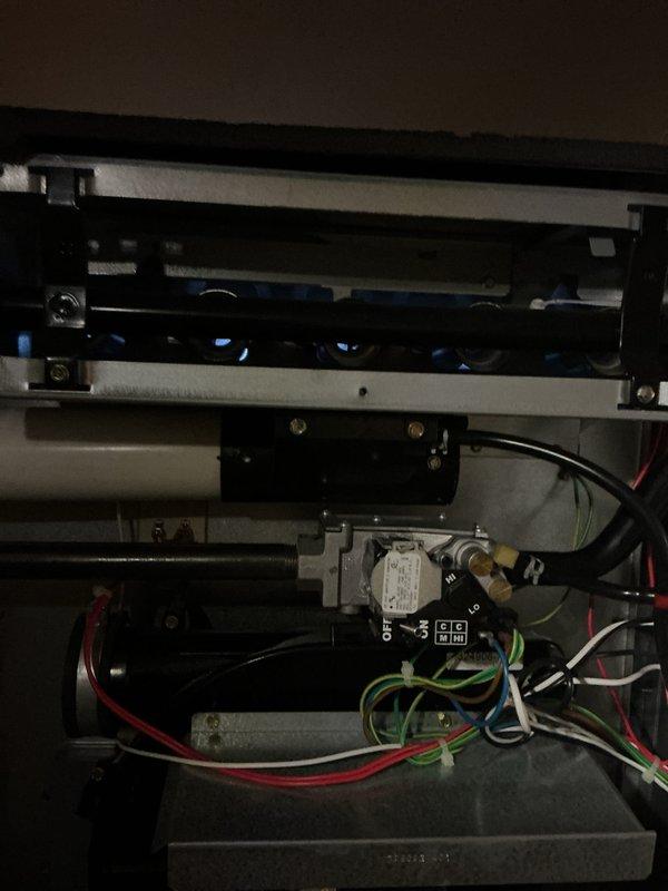 Completed comprehensive Gold Furnace Inspection on three forced-air heating units in a multi-unit residential property, with one unit located in the attic and two units in the basement. All furnaces are over 10 years old and were operational at time of inspection. Performed thorough visual examination of internal components including gas valve assemblies, blower motor assemblies, electrical connections, and control switches. Inspected burner compartments, heat exchangers, and condensate collection systems. Verified proper wiring configurations including safety controls and verified all connections were secure. Documented equipment condition through photographic evidence showing gas valve controls, electrical wiring bundles, blower motor assembly with mounting hardware, and condensate drainage pans. All three units passed inspection criteria with no immediate safety concerns identified and are functioning within normal operational parameters.
