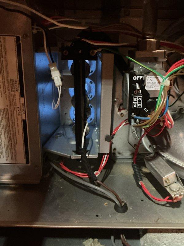 Completed comprehensive Gold Furnace Inspection on three forced-air heating units in a multi-unit residential property, with one unit located in the attic and two units in the basement. All furnaces are over 10 years old and were operational at time of inspection. Performed thorough visual examination of internal components including gas valve assemblies, blower motor assemblies, electrical connections, and control switches. Inspected burner compartments, heat exchangers, and condensate collection systems. Verified proper wiring configurations including safety controls and verified all connections were secure. Documented equipment condition through photographic evidence showing gas valve controls, electrical wiring bundles, blower motor assembly with mounting hardware, and condensate drainage pans. All three units passed inspection criteria with no immediate safety concerns identified and are functioning within normal operational parameters.