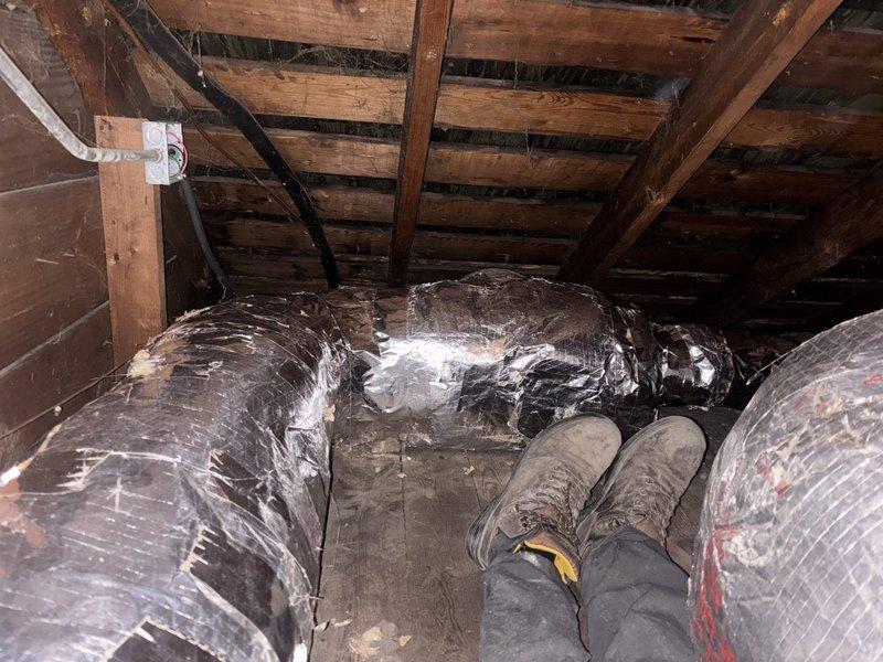 Completed a two-day installation of a 4-ton rear-discharge air handler system in attic space, including condenser reconnection and flexible ductwork routing through existing structural framework. Installed drain pan with wet switch safety control, verified all mechanical connections, and ensured proper system integration with existing HVAC infrastructure. Mechanical permit obtained and final measurements documented for code compliance verification.