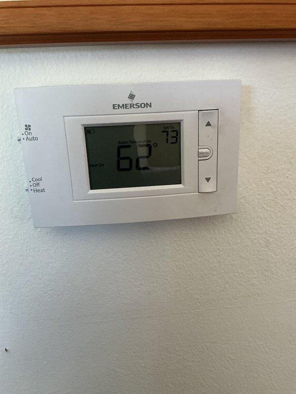 Responded to no-heat call where furnace was cycling on but not delivering warm air through vents. Upon arrival, found thermostat calling for heat with a 11-degree temperature differential (62°F actual vs 73°F setpoint). Inspected furnace unit and determined system was experiencing ignition failure or flame sensor malfunction preventing burner operation. Diagnosed issue, performed necessary repairs to restore heating function, and verified proper system operation with adequate airflow through supply vents.