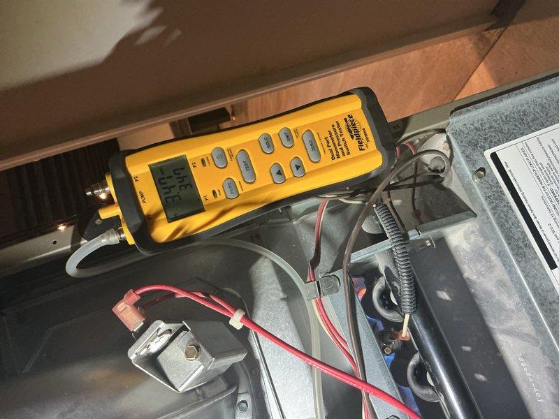 Completed comprehensive Gold Furnace Inspection on 20-year-old unit located in basement. Performed thorough diagnostic testing of furnace components using calibration meter, inspected blower motor assembly, verified electrical connections and wiring integrity, and examined ductwork connections. Evaluated Carrier humidifier operation and mounting, checked thermostat functionality, and inspected hot water tank as part of the comprehensive maintenance protocol. All system components photographed and documented for service records.