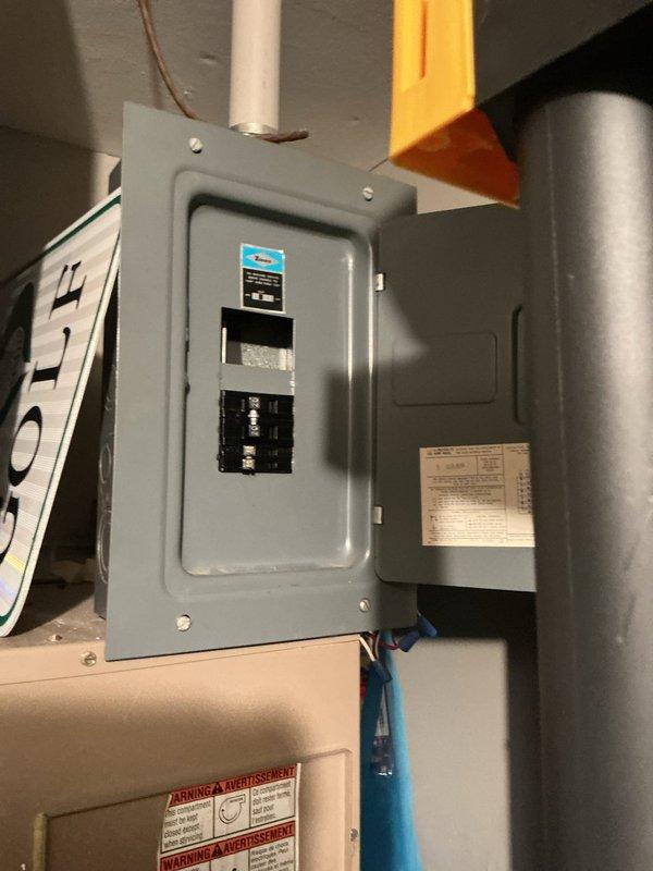 Responded to service call for electric furnace continuously running and unable to shut off without breaker intervention. Upon arrival, inspected thermostat and found faulty relay causing the heating system to remain energized regardless of temperature setpoint. Removed thermostat cover to examine internal circuit board and wiring connections. Identified malfunctioning control board preventing proper communication between thermostat and furnace unit. Temporarily disabled power at electrical panel to safely assess system. Verified furnace located in common storage area was still producing heat due to stuck relay contacts. Recommended thermostat replacement to restore proper system cycling and prevent continuous operation.