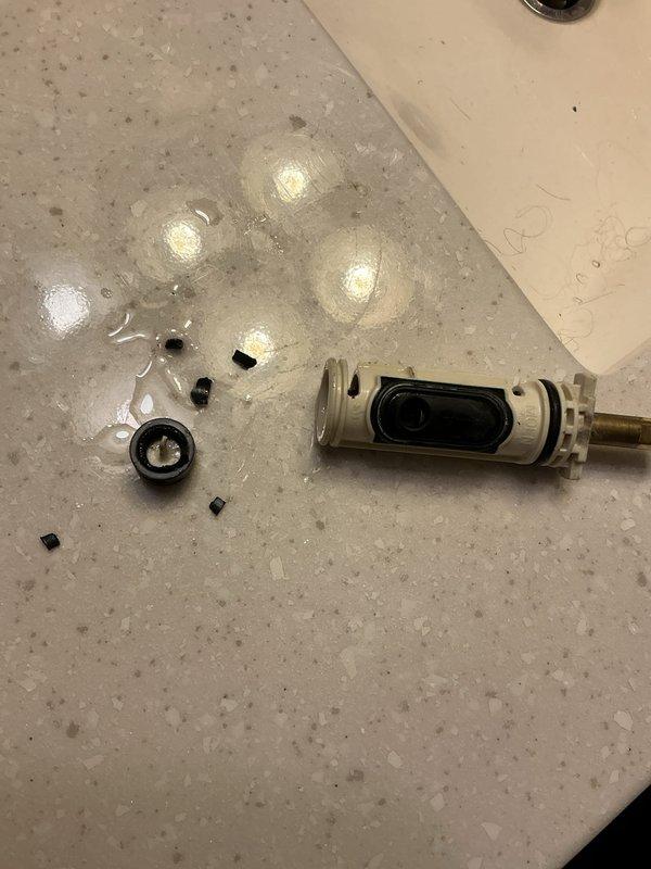 Responded to service call for no hot water and low water pressure on recently installed tanked water heater system covered under warranty. Upon inspection, identified debris and failed O-rings within faucet cartridge assembly causing restricted water flow throughout the residence. Disassembled and removed cartridge, replaced worn rubber seals and O-rings, cleared internal obstruction, and reassembled plumbing fixture. Verified proper water pressure restoration and confirmed water heater operation with adequate hot water supply to all fixtures.