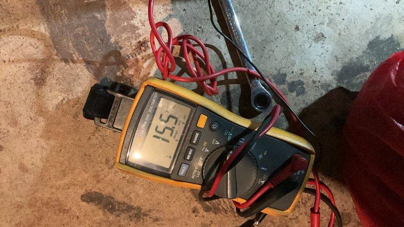 Responded to no heat call on 14-year-old boiler located in basement. Upon arrival, confirmed unit was receiving power and control components were energizing, but boiler failed to ignite. Performed diagnostic testing using multimeter, measuring 15.5 volts at critical circuit points. Inspected heat exchanger assembly, which showed significant dust accumulation, discoloration, and minor corrosion on metallic fins and surfaces. Identified ignition failure as primary issue preventing burner from firing. Cleaned heat exchanger components and addressed ignition system malfunction to restore proper operation and heating functionality to the residence.