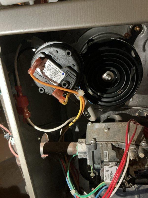 Responded to no heat call with Ecobee thermostat calling for heat but furnace unable to maintain temperature above 50 degrees. Performed diagnostic on basement-located furnace unit over 10 years old. Inspected blower motor assembly, pressure switch, gas valve, and associated electrical connections. Identified issue preventing proper heating cycle operation and verified all safety controls and wiring connections to gas valve and blower components were functioning correctly.