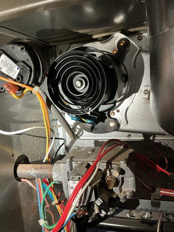 Responded to no heat call with Ecobee thermostat calling for heat but furnace unable to maintain temperature above 50 degrees. Performed diagnostic on basement-located furnace unit over 10 years old. Inspected blower motor assembly, pressure switch, gas valve, and associated electrical connections. Identified issue preventing proper heating cycle operation and verified all safety controls and wiring connections to gas valve and blower components were functioning correctly.