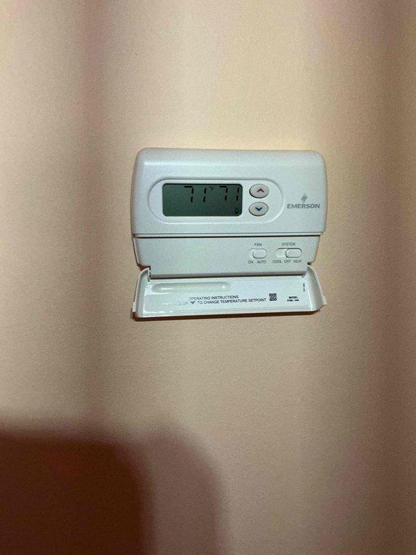 Completed comprehensive furnace tune-up and inspection on 2-year-old unit located in basement mechanical room. Performed full system evaluation including combustion analysis, heat exchanger inspection, blower motor operation, gas pressure verification, and safety control testing. Inspected and tested Emerson programmable thermostat for proper operation and calibration, verified current temperature reading of 77.1°F and confirmed all heating and cooling modes functioning correctly. Checked condensate drainage system including PVC piping and condensate pump for proper operation. Evaluated humidifier components and water supply connections. Performed visual inspection of gas-fired water heater including gas line connections, venting, and safety labels. Verified all electrical connections secure, tested furnace ignition sequence, and confirmed proper airflow through ductwork. System operating within manufacturer specifications with no deficiencies noted at time of inspection.