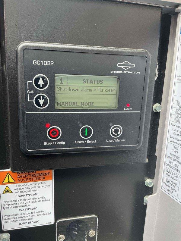 Responded to callback for 12KW Generac generator with flashing blue light. Diagnosed shutdown alarm on Briggs-Stratton GC1032 control panel displaying "Shutdown alarm > Pls clear" message in manual mode. Performed electrical testing on contactor terminals to verify component operation. Starter relay identified as faulty and will require replacement from shop inventory.