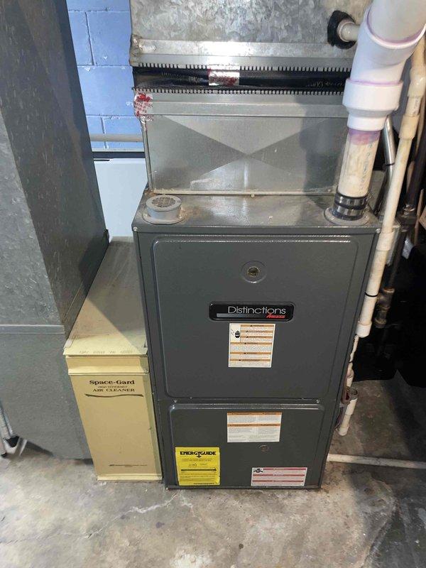 Performed comprehensive full system estimate including combustion analysis and heat exchanger inspection on existing Distinctions furnace with Space-Gard air filtration system. Evaluated current outdoor AC unit for replacement options, providing comparison quotes for standard air conditioning replacement versus cold-climate heat pump upgrade in dual-fuel configuration with existing gas furnace.