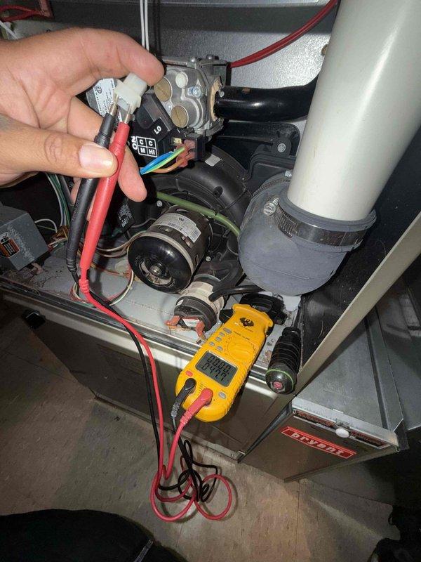 Responded to service call for 12-year-old Bryant furnace experiencing short cycling without producing heat. Performed diagnostic testing using multimeter to check electrical components and connections within the unit. Inspected inducer motor assembly, pressure switch connections, and gas valve operation to identify cause of premature shutdown during heating cycle.