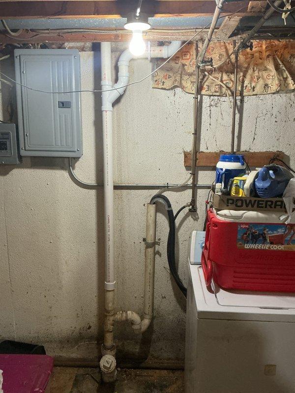 Completed kitchen drain line repair in basement utility area. Diagnosed issue with existing plumbing system where kitchen waste line connects to main stack. Repaired PVC drainage piping with proper fittings and connections to restore proper flow and eliminate backup concerns. System tested and confirmed operational.