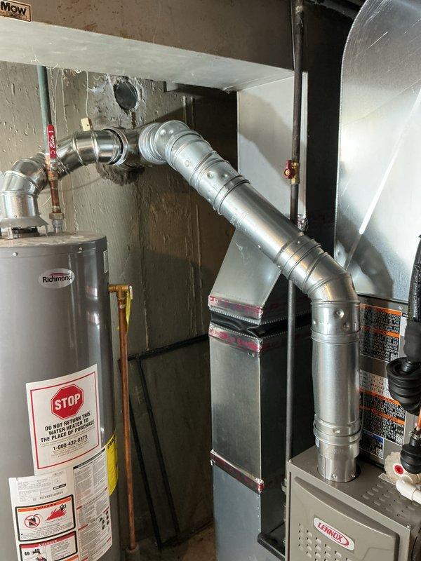 Completed full HVAC system installation including Lennox 70,000 BTU furnace and 2-ton air conditioning unit in rear yard location. Installed new thermostat, condensate pump, and ductwork with liner, performed all mechanical reconnections, and coordinated electrical work. Mechanical and electrical permits obtained, system registered for utility rebate program with AHRI certificate 21558456, and all equipment labeled and documented per code requirements.