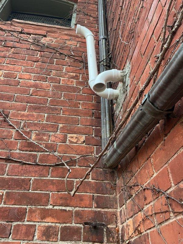 Responded to warranty service call for newly installed boiler system experiencing fluid accumulation in vent pipe and reduced water pressure. Upon inspection, identified improper PVC venting termination and configuration issues on exterior brick wall. Corrected boiler exhaust and intake venting system by installing 2" PVC pipe and 90-degree elbow fittings to achieve proper termination height and positioning. Verified proper condensate drainage, restored adequate system water pressure, and confirmed all venting meets manufacturer specifications and code requirements for safe operation.