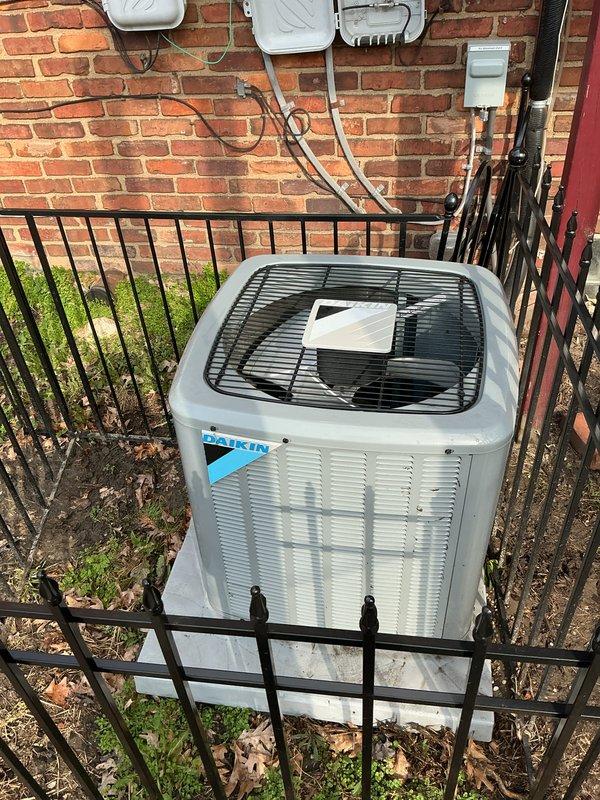 Completed comprehensive Gold Plan AC inspection on Daikin split system with attic-mounted horizontal air handler and exterior condenser unit. Performed full system evaluation including visual inspection of indoor air handler components, ductwork connections, electrical connections, and condensate management in attic location. Inspected outdoor condenser unit for proper operation, cleared debris from surrounding area, verified adequate clearances, examined electrical disconnect and power supply connections at exterior wall. All system components found operating within normal parameters with no immediate service needs identified at time of inspection.