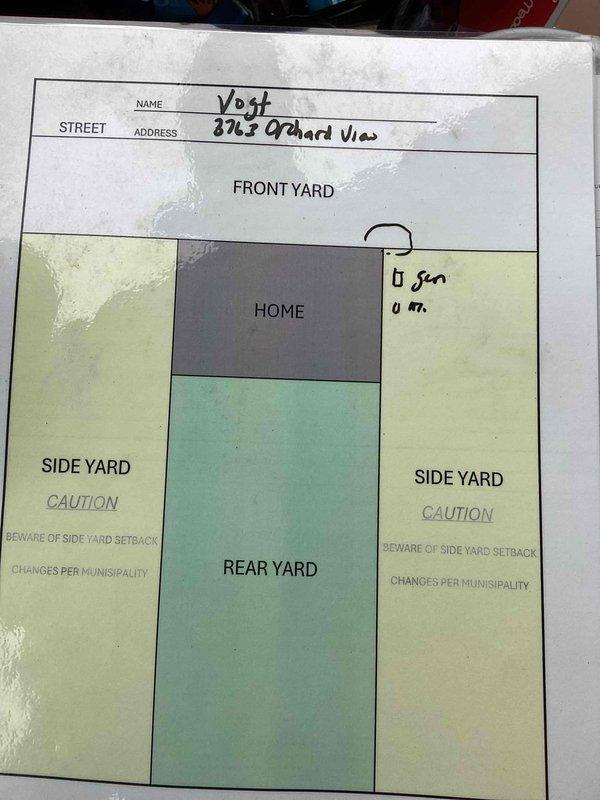 Conducted on-site evaluation for backup generator installation at residential property. Reviewed property plot plan showing home layout, front yard, rear yard, and side yard setback requirements to determine optimal generator placement while maintaining municipal code compliance. Assessed basement utility area and examined existing electrical infrastructure, including main service panel location, structural support posts, floor joists, and available space for transfer switch installation. Documented site conditions through photographs of property diagram and basement electrical service area. Identified appropriate generator placement location considering gas line access, electrical service entry point, and clearance requirements from structure. Evaluated load requirements and existing electrical panel capacity to determine proper generator sizing and automatic transfer switch specifications for whole-house backup power system.