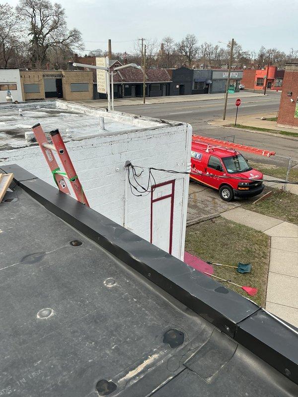 Responded to service call for commercial rooftop furnace with broken belt. Accessed roof using ladder and located unit among multiple HVAC systems on flat membrane roof. Removed failed belt and installed replacement belt, ensuring proper tension and alignment. Tested unit operation to verify proper function and airflow. Unit restored to full operational status.