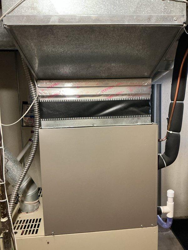 Responded to no-ignition complaint on basement-located furnace over 10 years old. Performed diagnostic evaluation and identified cracked heat exchanger, rendering unit unsafe for operation. Provided comprehensive replacement estimate for new HVAC system including furnace and associated components, documented existing Bryant Plus 80 equipment configuration with photos showing current installation layout, ductwork connections, and venting system for replacement planning purposes.