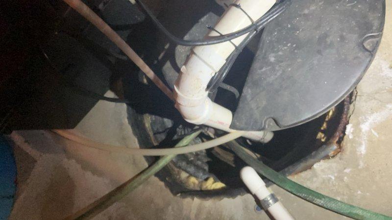 Responded to service call for sprinkler system supply line requiring repair. The issue involved a water supply pipe running through the interior of the residence to the exterior sprinkler system connection point. Upon inspection, identified deteriorated plumbing components in the utility area, including corroded piping connections and compromised fittings near water distribution equipment. Performed diagnostic assessment of the water supply routing from interior mechanical space through structural framing to exterior hose bib connection. Documented existing conditions showing significant corrosion on mechanical equipment and aging PVC supply lines with multiple connection points. Repaired the affected pipe section serving the sprinkler system, ensuring proper water flow restoration and eliminating the leak condition at the faucet connection point.