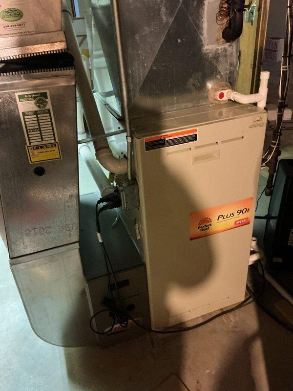 Completed comprehensive spring AC tune-up on residential cooling system. Performed standard maintenance protocol including inspection of condenser unit, refrigerant level verification, electrical connection testing, and air filter replacement. Inspected brand new bedroom air purifier unit reported as non-operational; identified power supply issue and restored unit to proper working condition. All HVAC equipment including furnace and water heater systems photographed and documented as functioning within normal parameters.