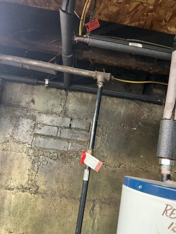 Responded to emergency call for leaking hot water tank in basement with water discharge from bottom of unit. Upon inspection, determined tank had failed and required complete replacement due to irreparable leak at base. Disconnected and removed existing failed water heater, including all supply lines, discharge piping, and electrical connections. Installed new tanked water heater with proper venting, connected hot and cold water supply lines with appropriate shut-off valves, and installed temperature and pressure relief valve with proper discharge piping termination. Reconnected all plumbing connections using code-compliant materials and methods, ensuring proper clearances around unit for maintenance access. Tested all connections for leaks, verified proper water flow and heating operation, and confirmed system functionality before completing installation. Unit now operating within normal parameters with no active leaks detected.