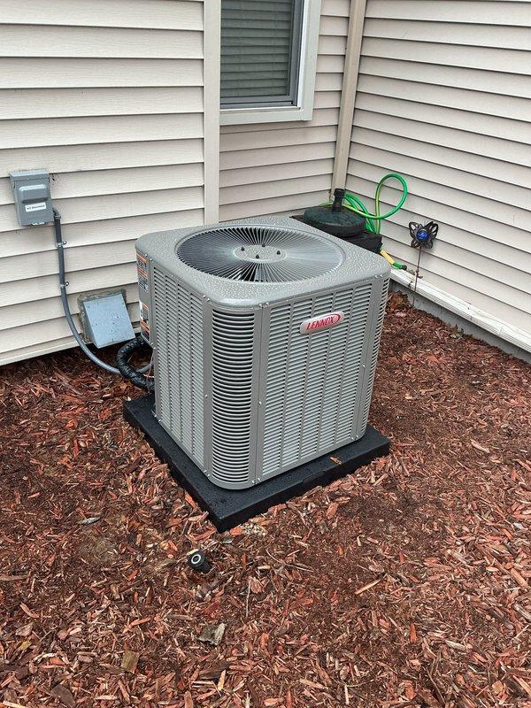 Completed full HVAC system installation including a Lennox 70,000 BTU furnace and 2.5-ton air conditioning unit with rear discharge configuration. Installed new 500-series humidifier and reconnected existing ductwork to new equipment. Performed refrigerant line flush and added new electrical wiring to code. Positioned outdoor condenser unit on composite pad with proper electrical disconnect box and conduit installation. Mounted furnace in basement utility area with proper plenum connections, PVC venting, and copper refrigerant lines with insulation. Requested and obtained mechanical and electrical permits for the installation. System qualifies for utility rebate program with AHRI certification number 21558662.
