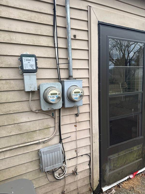 Completed full HVAC system installation including 70,000 BTU furnace and 2.5 ton rear-discharge air conditioning unit with new thermostat and condensate pump. Performed system flush, installed liner, and reconnected all electrical and mechanical components. Requested mechanical and electrical permits, verified proper gas pressure readings, documented installation for utility rebate programs with AHRI certificate number 21558666, captured photographic documentation of exterior electrical service equipment and diagnostic measurements, and confirmed system operation within manufacturer specifications.