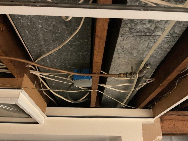 Conducted plumbing estimate for replacement of old capped copper gas line serving dryer location in basement of century-old single-family residence. Assessment included evaluation of existing gas piping from spring shutoff valve to dryer termination point, documentation of current system condition, and determination of scope for complete line replacement to restore safe gas supply to appliance.