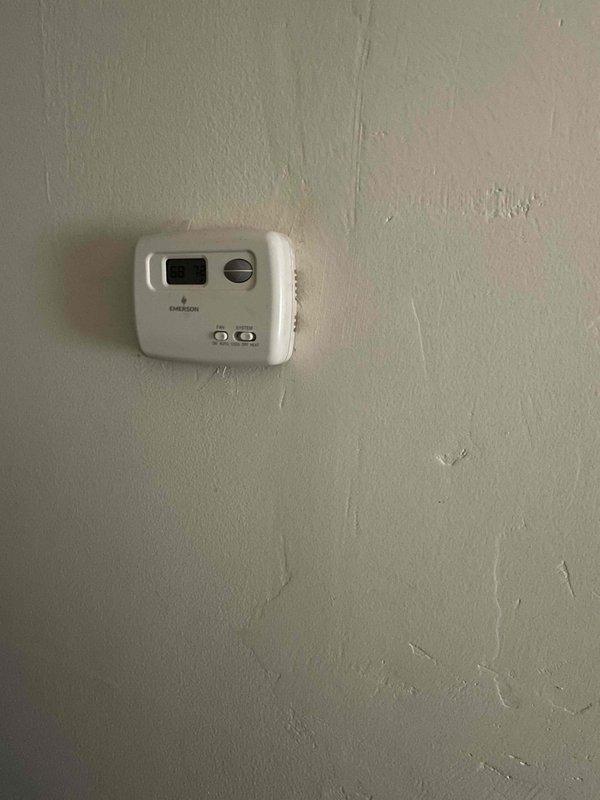 Provided replacement estimate for 10+ year old natural gas furnace located on first floor. Current unit is operational. Assessed existing system including Emerson thermostat, ductwork configuration, and utility room installation to determine equipment specifications and replacement requirements.