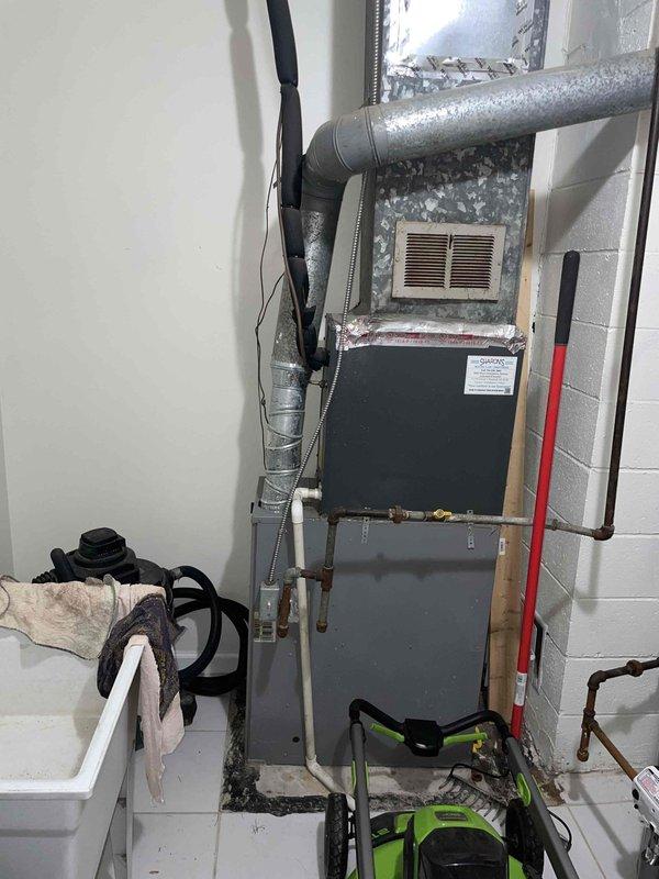 Provided replacement estimate for 10+ year old natural gas furnace located on first floor. Current unit is operational. Assessed existing system including Emerson thermostat, ductwork configuration, and utility room installation to determine equipment specifications and replacement requirements.