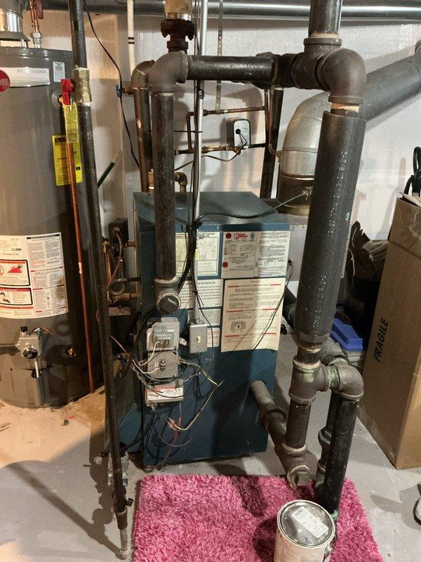 Responded to service call for boiler with pilot light that would not remain lit. Performed diagnostic evaluation on basement-located unit over 10 years old and identified faulty vent damper as root cause of pilot failure. Ordered replacement vent damper for installation upon arrival at shop.