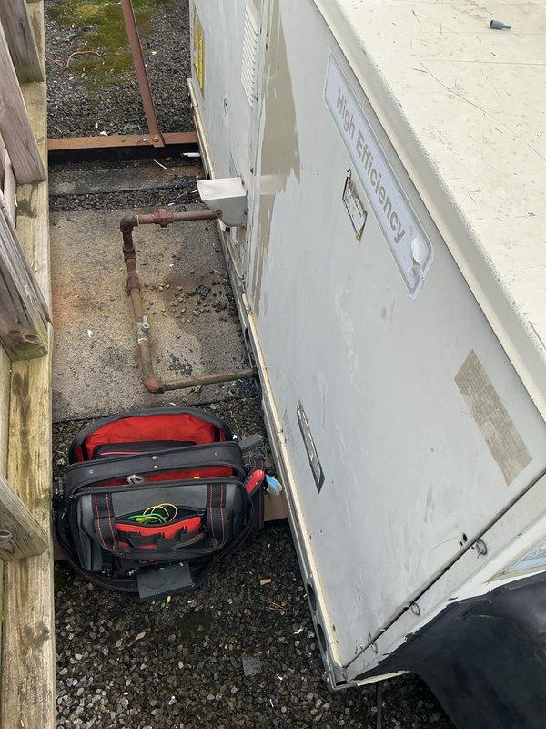 Responded to no-heat call on commercial rooftop unit where building was operating on generator power due to main power outage. Diagnosed failed gas valve assembly preventing furnace ignition sequence, though blower motor was operational. Removed and replaced defective gas valve assembly including reconnection of copper tubing, electrical connections, and pressure lines. Verified proper gas flow, tested ignition sequence, and confirmed unit returned to normal heating operation once main power was restored.