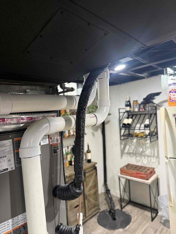 Responded to complaint of noisy air conditioning unit during start-up on approximately 1-year-old system. Performed diagnostic inspection of outdoor condensing unit and indoor evaporator coil located in basement. Identified and addressed noise issue related to refrigerant line vibration and secured loose components at exterior unit connections. System tested through complete cooling cycle and verified quiet operation with proper start-up sequence.