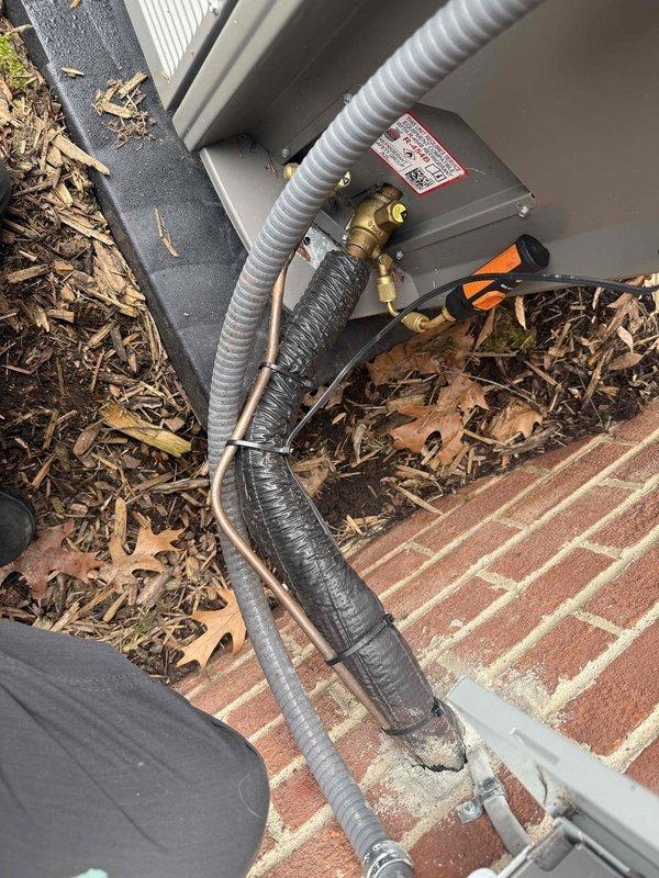 Responded to complaint of noisy air conditioning unit during start-up on approximately 1-year-old system. Performed diagnostic inspection of outdoor condensing unit and indoor evaporator coil located in basement. Identified and addressed noise issue related to refrigerant line vibration and secured loose components at exterior unit connections. System tested through complete cooling cycle and verified quiet operation with proper start-up sequence.