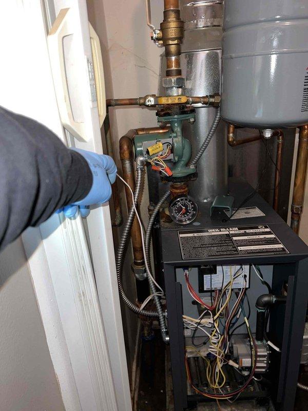 Responded to service call for 4-year-old boiler with ignition failure. Upon arrival, accessed control box and circulator pump assembly in utility room to diagnose no-heat condition. Inspected electrical connections, wiring harnesses, and safety controls within the heating system. Examined expansion tank, pressure gauge readings, and circulation pump operation. Tested ignition sequence and verified proper valve operation throughout the copper piping system. Troubleshot control board connections and safety interlocks to identify cause of ignition malfunction.