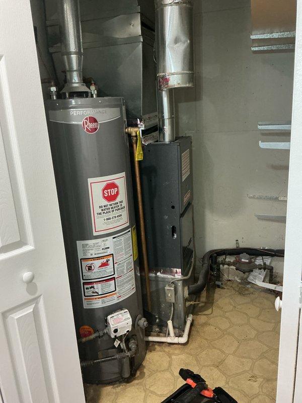 Completed comprehensive furnace tune-up and safety inspection on main floor heating system. Performed visual inspection of burner assembly, confirmed proper ignition with clean blue flame combustion across all burners, and verified gas connections and yellow flex line for secure fittings. Inspected thermostat operation, humidifier functionality, and hot water tank condition as part of complete system evaluation. All components operating within normal parameters at time of service.