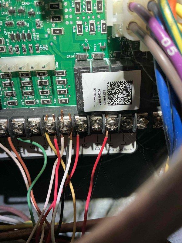 # No Heat Service Call - 4-Year-Old Unit

Responded to no heat call on 4-year-old HVAC system located in basement. Thermostat had power and was functioning properly, but unit was not responding to call for heat. Performed diagnostic inspection of furnace control system and accessed main control compartment. Examined integrated control board assembly, wiring connections, and safety circuit components. Inspected terminal block connections for loose or corroded wires. Verified proper voltage at board terminals and checked all wire connections at control board and terminal strip. Evaluated condition of control board capacitors, relays, and integrated circuits for signs of failure. Checked all safety device circuits including limit switches and pressure switches. Photographed control board assembly and wiring configuration for documentation purposes. System restored to proper operation.