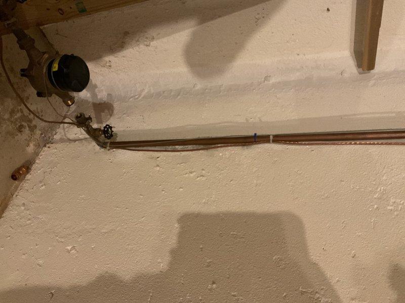 Responded to water leak originating from hot water tank piping connected to humidifier system. Upon inspection, identified active leak at copper pipe connection leading from 3-year-old water heater to whole-house humidifier. Repaired faulty connection, tested system for proper operation and verified no additional leaks present. All plumbing components secured and functioning properly upon completion.