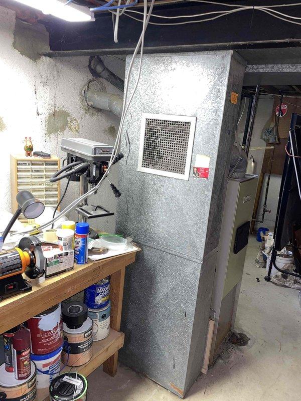 Responded to service call for 52-year-old furnace with non-operational blower in basement location. Diagnostic testing revealed severely sooted combustion chamber with carbon monoxide levels exceeding 2000ppm in exhaust gases, maxing out analyzer capabilities and indicating dangerous incomplete combustion. Unit operates at 70% efficiency and exhibits critical safety concerns requiring immediate attention. Provided comprehensive replacement estimate for new furnace system due to age of equipment and hazardous operating conditions that cannot be safely remediated through repair.
