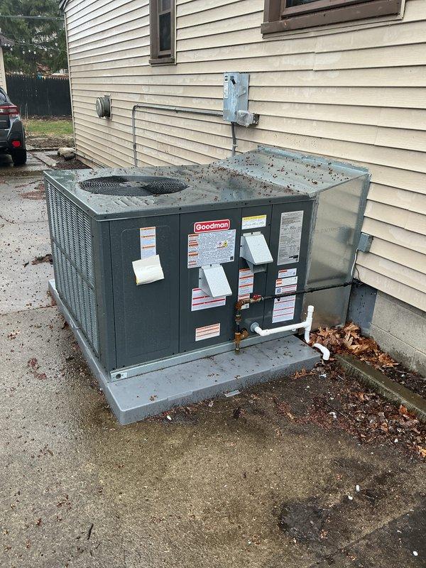 Performed system start-up on Goodman packaged heating and cooling combo unit installed on concrete pad adjacent to residential structure. Verified proper operation of all components, checked refrigerant line connections at building penetration, and confirmed electrical connections at exterior meter location. Unit operational and performing to manufacturer specifications.