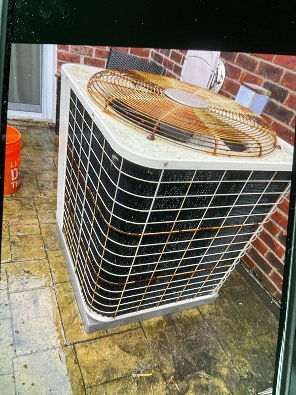 Completed comprehensive Gold AC inspection on 34-year-old residential air conditioning system with air handler located in basement and condensing unit positioned exterior against building. Performed electrical diagnostics using clamp meter, measuring voltage and amperage at control board to verify proper system operation, inspected all electrical connections, wiring, and components within air handler cabinet. Conducted thorough examination of outdoor condensing unit including fan motor operation, refrigerant pressures, and overall mechanical condition, noting unit's advanced age and continued functionality.