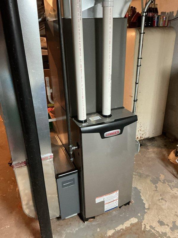 Performed AC system startup and commissioning on newly installed basement evaporator coil and furnace system. Verified proper refrigerant charge, airflow through metal plenum and ductwork, and confirmed all electrical connections to the furnace unit. Tested system operation including blower motor function, verified intake and exhaust venting through white PVC pipes, and ensured proper condensate drainage. System startup completed successfully with all components operating within manufacturer specifications.