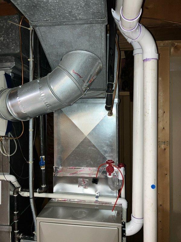 Provided comprehensive estimate for replacement of 10+ year old residential air conditioning unit. Existing system currently operational with natural gas furnace, Honeywell Enviracare Elite humidifier, and standard ductwork configuration located in basement utility area. Documented current equipment specifications including air handler, metallic supply plenum, PVC condensate drainage system, and existing humidification components to ensure accurate sizing and compatibility recommendations for new AC unit installation.
