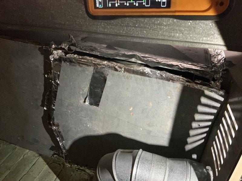 Completed comprehensive tune-up inspection on basement-located furnace unit. Performed visual inspection of all accessible components, utilized borescope camera to examine internal ductwork and heat exchanger passages for cracks, corrosion, or blockages. Documented existing cabinet damage with exposed metal edges and deterioration at top panel seam. All equipment operational at time of service, system running as designed with no immediate safety concerns identified.