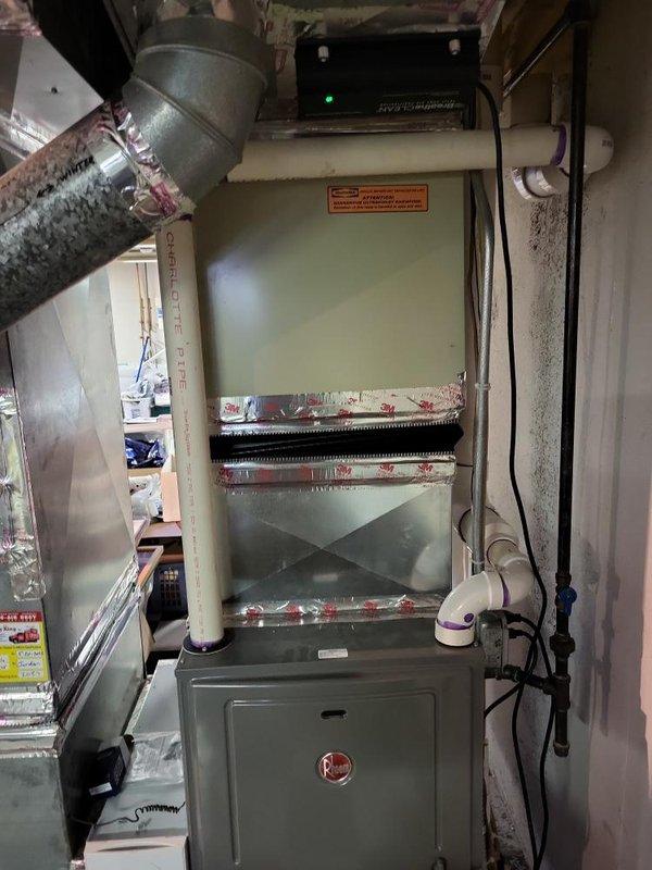 Conducted comprehensive evaluation of 20-year-old residential air conditioning system located on east side of property in backyard area. Assessed existing equipment condition, reviewed current HVAC infrastructure including furnace installation in basement utility area, electrical panel configurations, and ductwork connections. Documented system specifications and photographed existing equipment setup to provide detailed estimate for complete AC unit replacement. Evaluated electrical service capacity with dual panel system to ensure adequate power supply for new equipment installation. Prepared replacement recommendations based on current system age, operational efficiency requirements, and existing infrastructure compatibility.