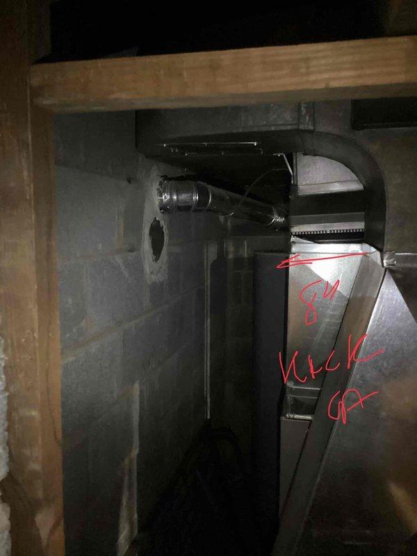 Provided estimate for replacement of 14-year-old natural gas furnace located in basement that sustained flood damage and ceased operation. Assessed existing gray metallic furnace unit within wooden frame structure, noting flood-related failure and need for complete system replacement. Documented current installation including ductwork connections, exhaust/intake piping, and exterior gas line configuration with shut-off valves mounted to brick foundation.