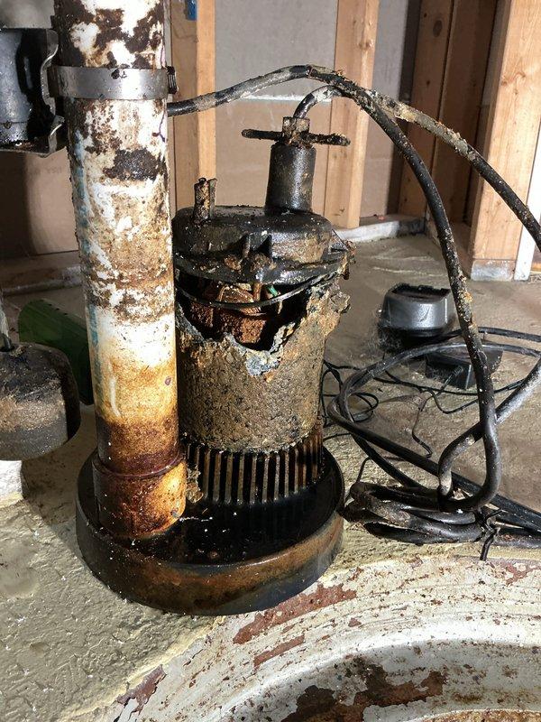 Responded to service request for sump pump evaluation and same-day installation following initial electrical assessment. Upon arrival, inspected existing sump pump system and found severe corrosion throughout the unit, including extensive rust damage to the pump housing, motor assembly, and discharge piping. The pump basin exhibited significant rust staining on interior walls with degraded protective coating. Water in the pit appeared dark and sediment-laden, indicating compromised pump performance.

Provided comprehensive estimate for complete sump pump replacement, including removal of failed corroded unit and installation of new pump system with appropriate discharge piping and electrical connections. Customer accepted estimate and authorized same-day installation. Removed deteriorated pump assembly and cleaned sump basin of accumulated sediment and debris. Installed new sump pump with check valve, ensuring proper float operation and discharge routing. Tested system operation throug
