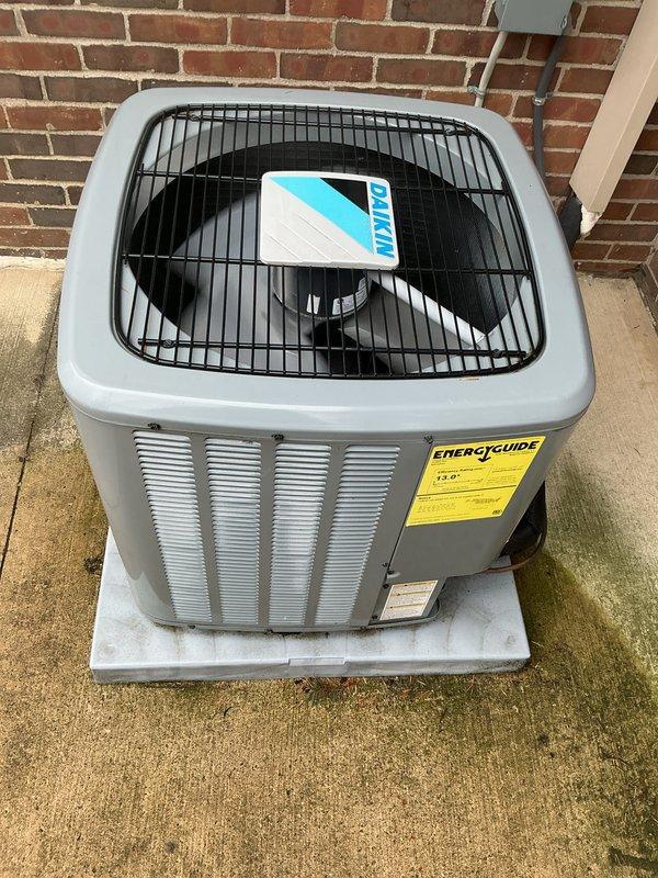 Completed comprehensive Gold AC inspection on residential property with multiple systems including a Daikin mini-split unit in garage and central AC system with air handler located in basement. Due to limited attic access, smaller technician performed inspection of less than 10-year-old equipment. Both outdoor condenser units were inspected and photographed, confirming proper mounting, adequate clearances from structures, and normal operational condition. All systems were functioning properly at time of inspection with no immediate repairs required.